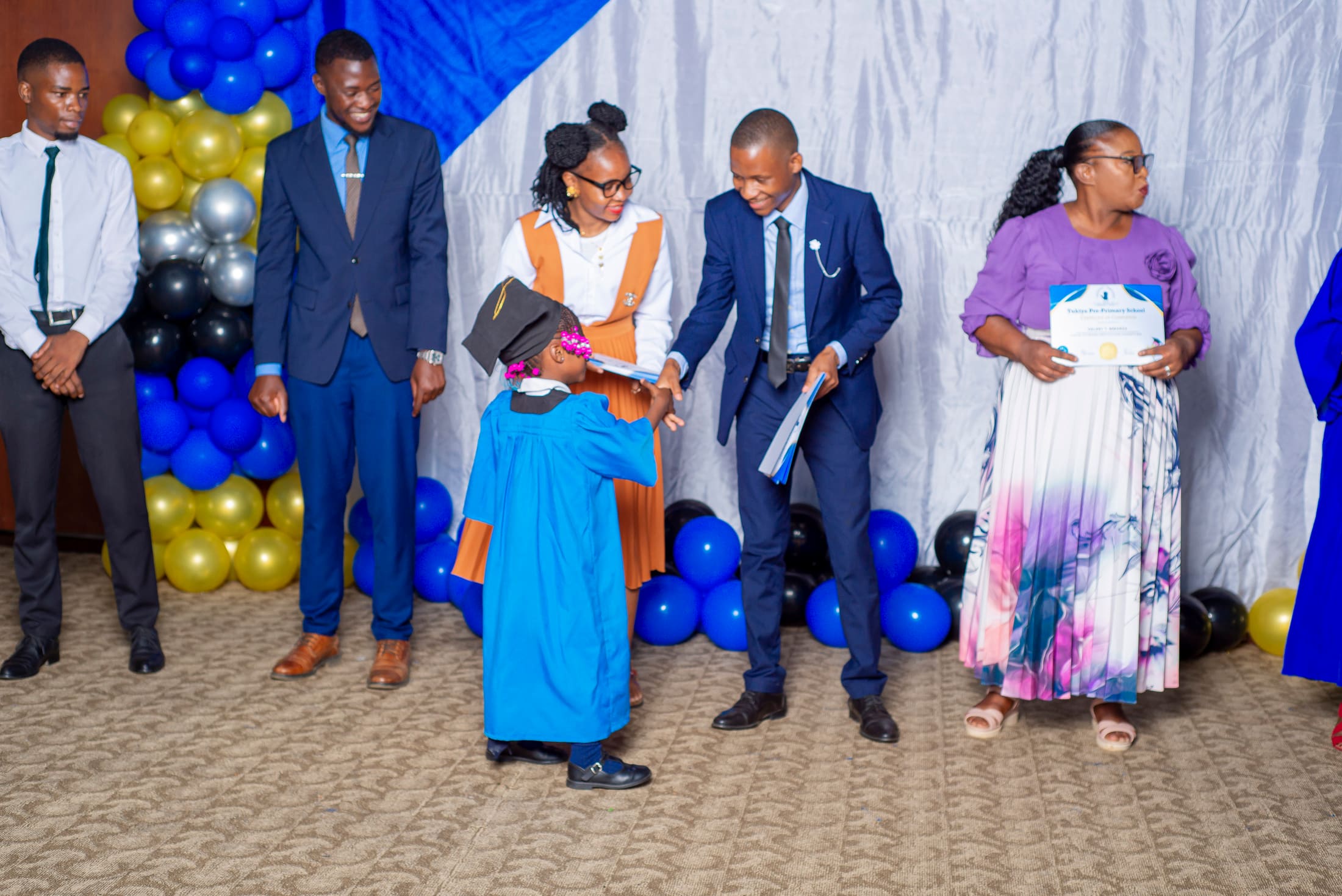 A graduate receiving her award on stage
